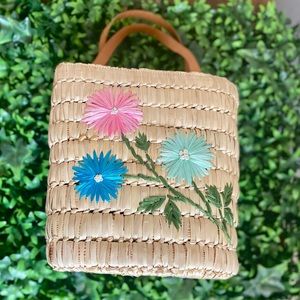Small tote wicker bag. So adorable in person.  Just the cute perfect size.